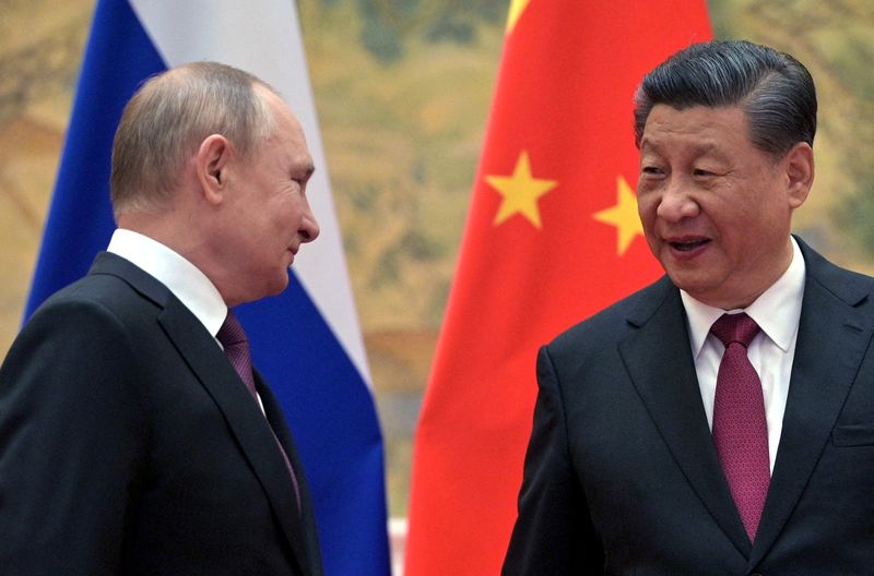 FILE PHOTO: Russian President Putin meets Chinese President Xi in