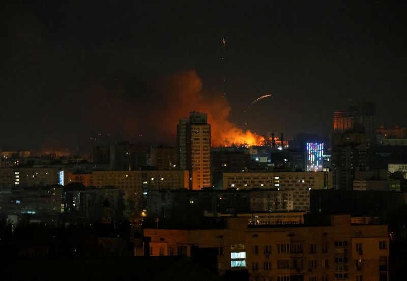 Smoke and flames rise over during the shelling near Kyiv