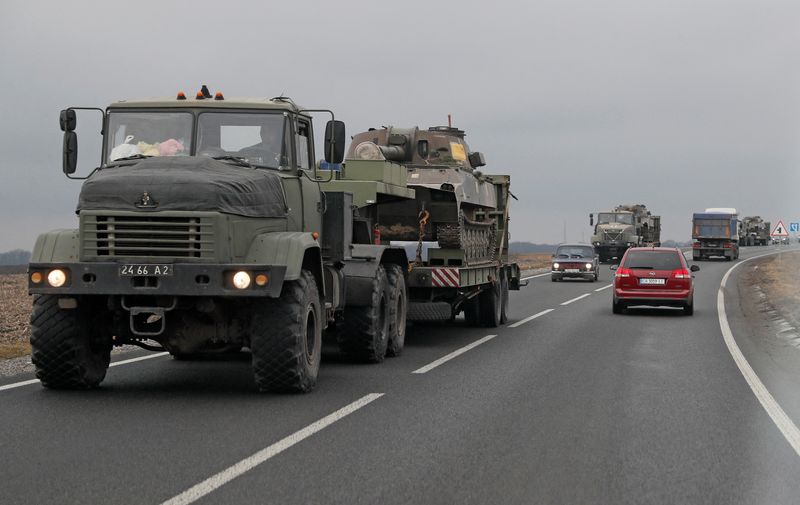 Trucks of the Ukrainian Armed Forces transport armoured vehicles in