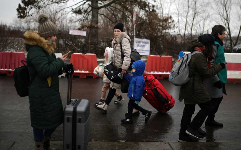 FILE PHOTO: People flee from Ukraine to Romania at the