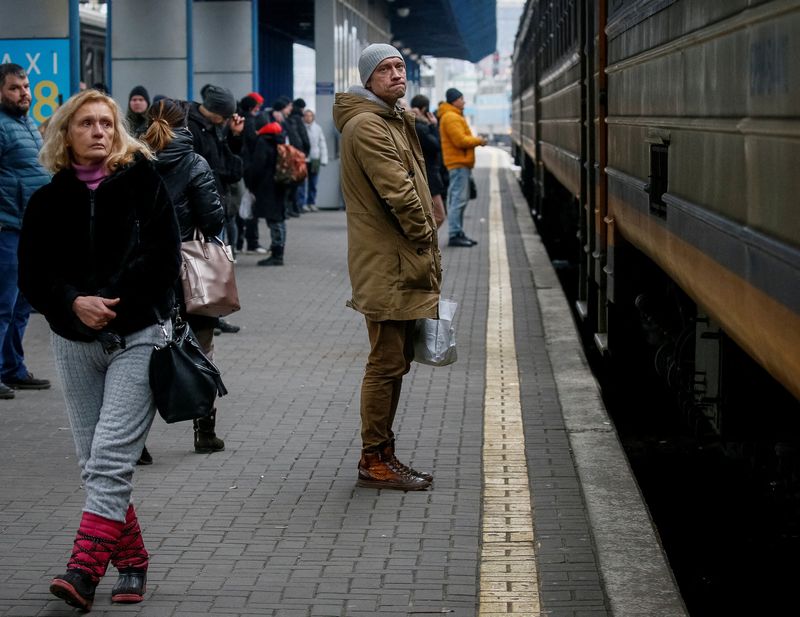 People board an evacuation train at Kyiv central train station