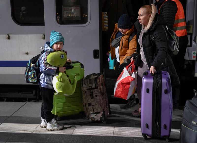 Refugees arrive in a train from Poland at Berlin’s central