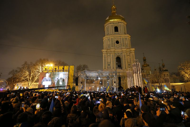 FILE PHOTO: Ukrainian believers gather at the front of the