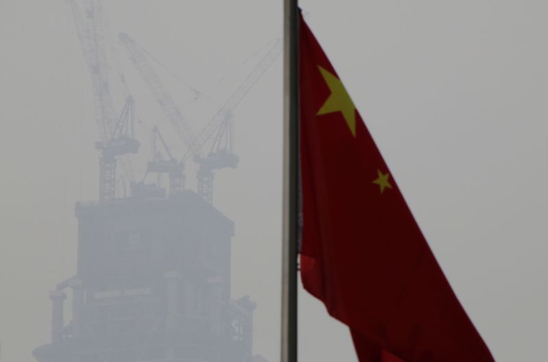 FILE PHOTO: A Chinese flag is seen near a construction