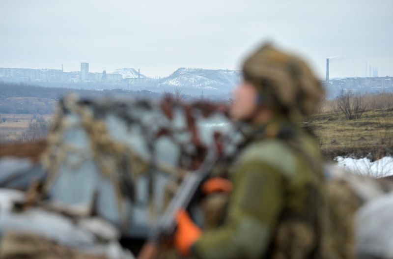 FILE PHOTO: Ukrainian service members guard the area near the