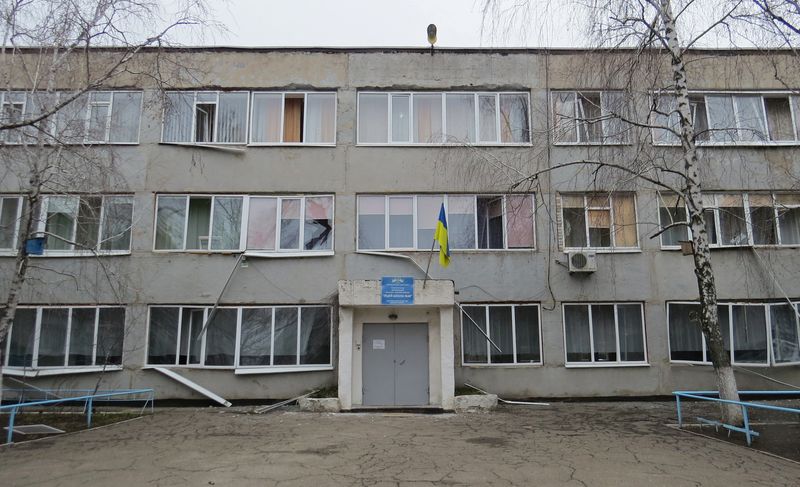 A view shows a damaged school building in Mariupol