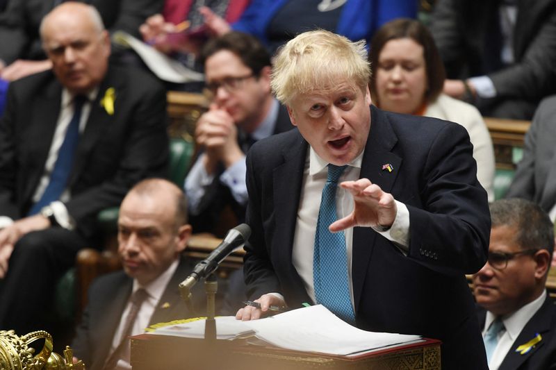 British Prime Minister Johnson gestures as he speaks during a