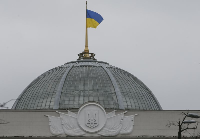 Ukrainian national flag flies over Parliament building in central Kiev