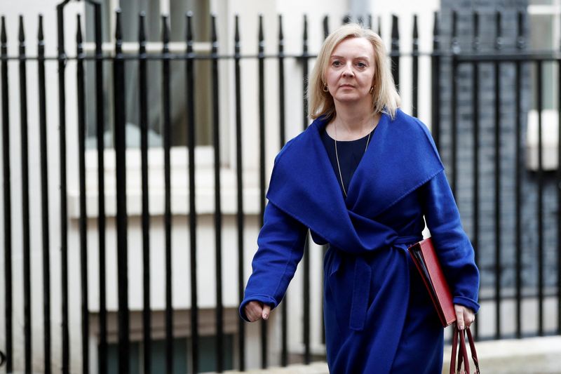 British Foreign Secretary Liz Truss walks outside Downing Street, in