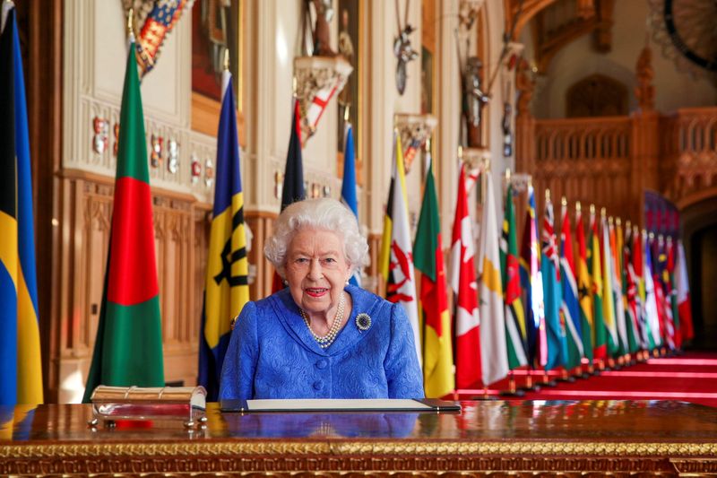 Britain’s Queen Elizabeth II signs her annual Commonwealth Day message