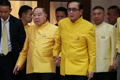 FILE PHOTO: Thailand’s Prime Minister Prayuth Chan-ocha holds hands with