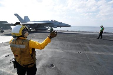 FILE PHOTO: Shooter and Controler prepare an F/A-18E Super Hornet