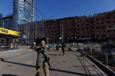 Ukrainian soldiers guard the vicinity of the Artem factory after