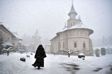 The Wider Image: Orthodox monks welcome Ukrainian refugees to their