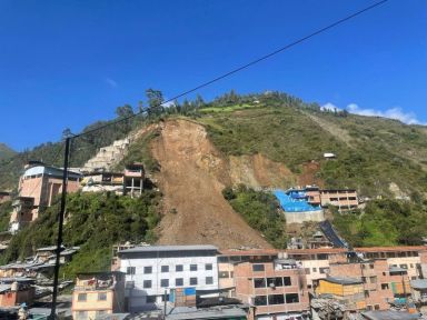 Landslide buries homes, in Retamas