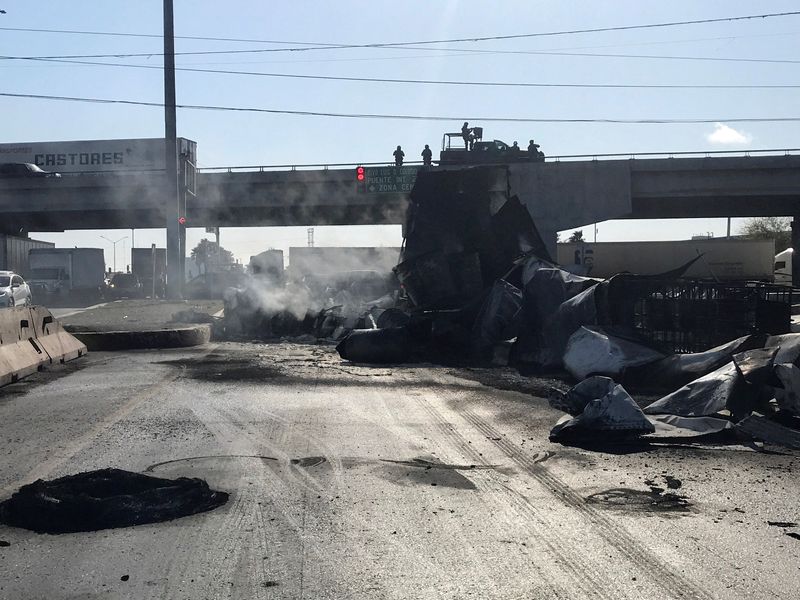 FILE PHOTO: Vehicle set ablaze after detention of a gang