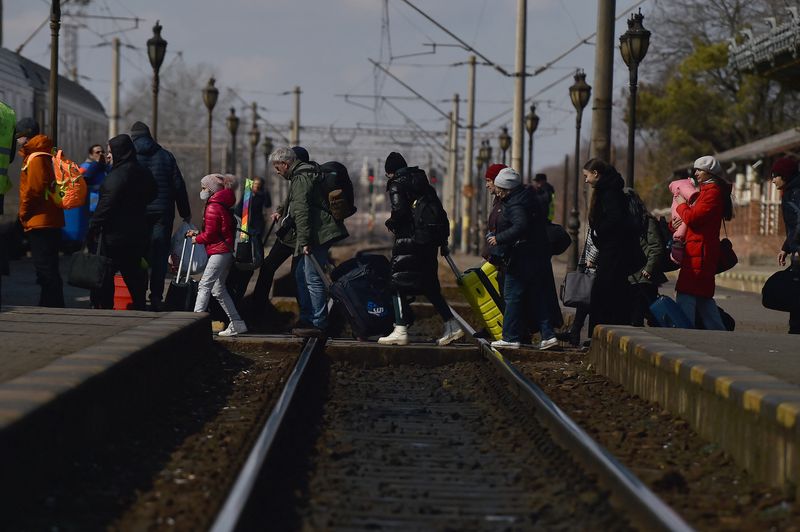 People fleeing Russia’s invasion of Ukraine arrive at Suceava train