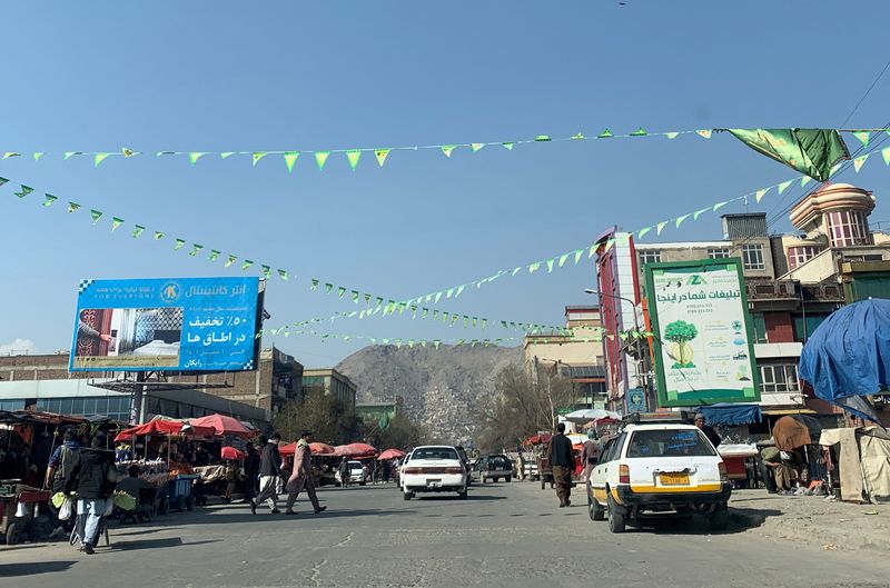 Flags strung up on a street ahead of the Persian