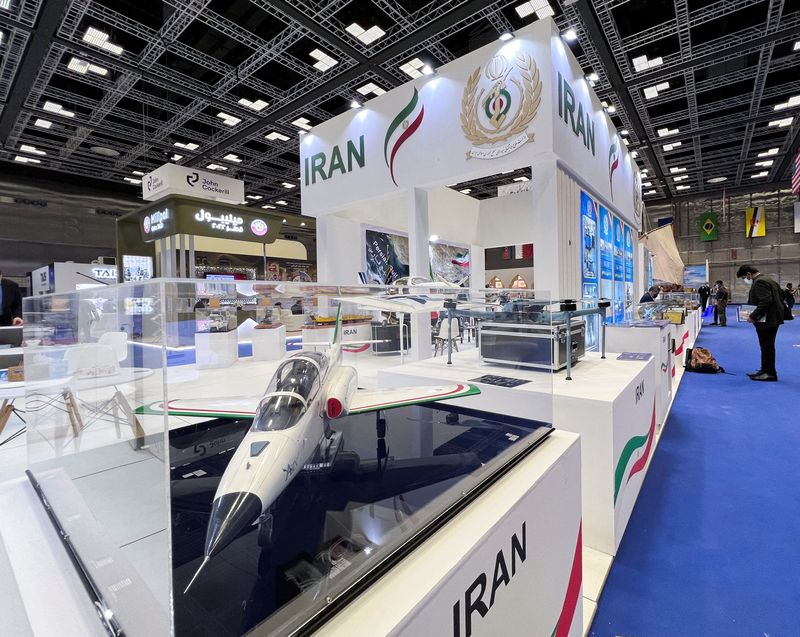 A military aircraft model is displayed at the IRGC booth