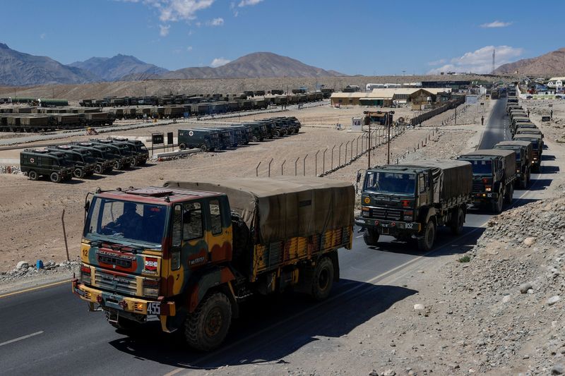 FILE PHOTO: Military trucks carrying supplies move towards forward areas