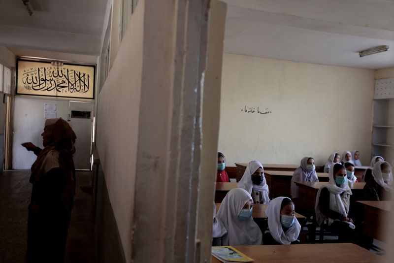FILE PHOTO: Girls attend classes in Kabul