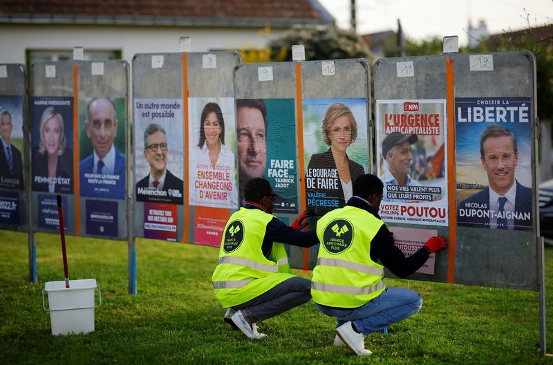 French presidential election candidates posters are pasted on electoral panels
