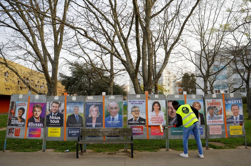 French presidential election candidates posters are pasted on electoral panels