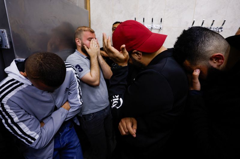 Relatives of Palestinian man react in Jenin in the Israeli-