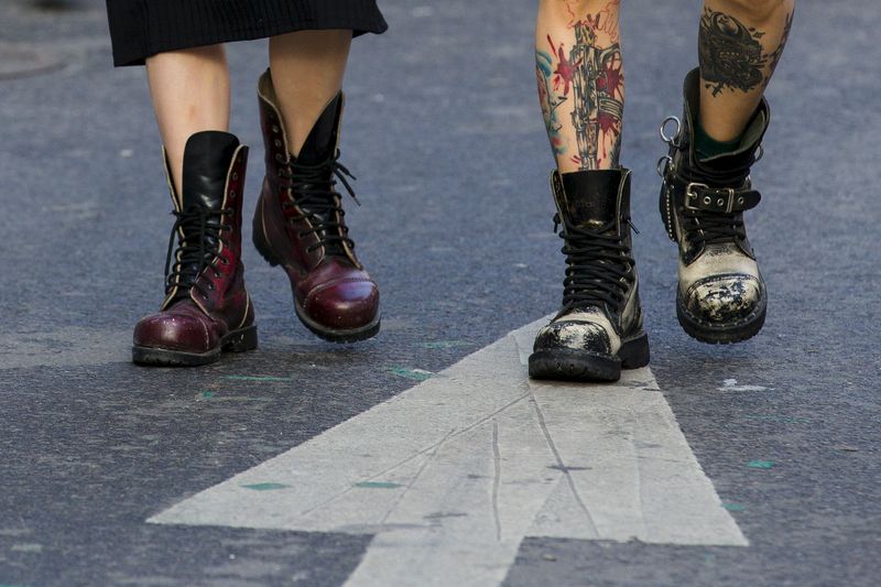 FILE PHOTO: Tattooed man and woman wear heavy boots as