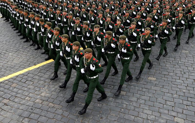 FILE PHOTO: Russian service members march during a military parade