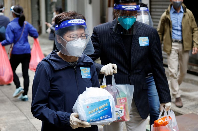 Hong Kong Chief Executive Lam delivers anti-epidemic bags to residents