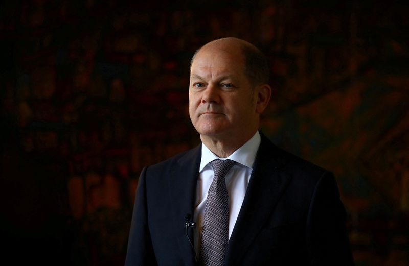 FILE PHOTO: German Finance Minister Olaf Scholz attends a Reuters