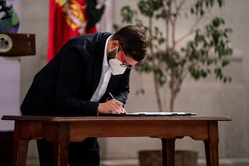 FILE PHOTO: Chile’s President Gabriel Boric signs the Escazu Agreement