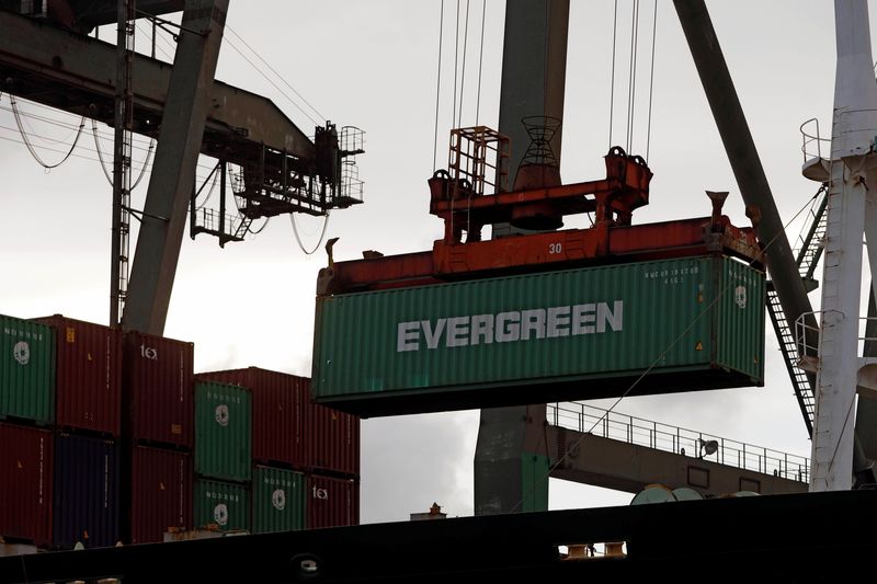A crane lifts a Evergreen Marine’s container at Kaohsiung Port