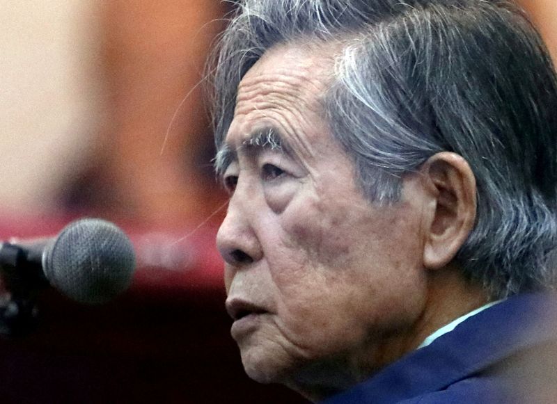 Former President of Peru Alberto Fujimori attends a trial as