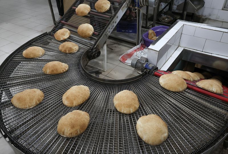 Freshly baked bread cools at a bakery in Beirut