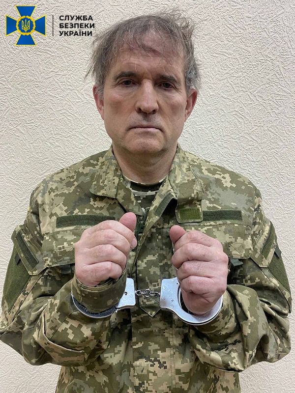 Pro-Russian Ukrainian politician Viktor Medvedchuk is seen in handcuffs while