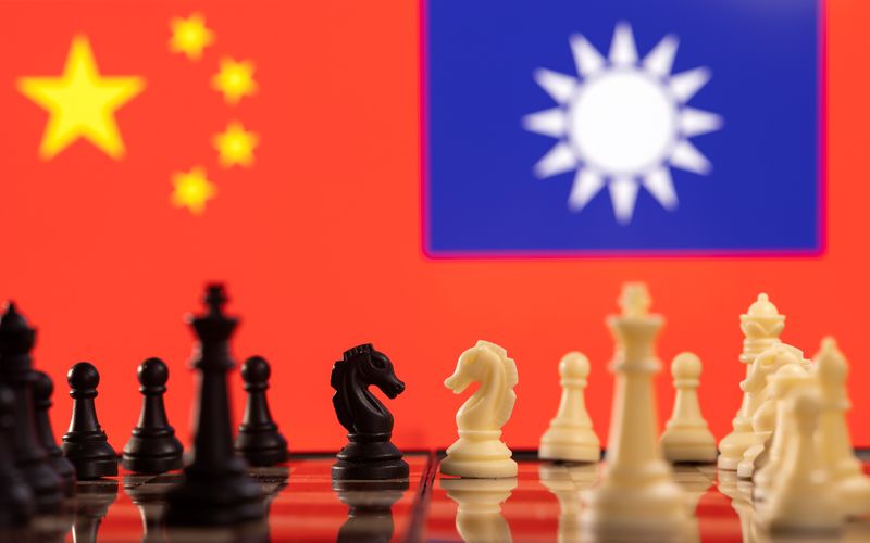 FILE PHOTO: Illustration shows China and Taiwan’s flags