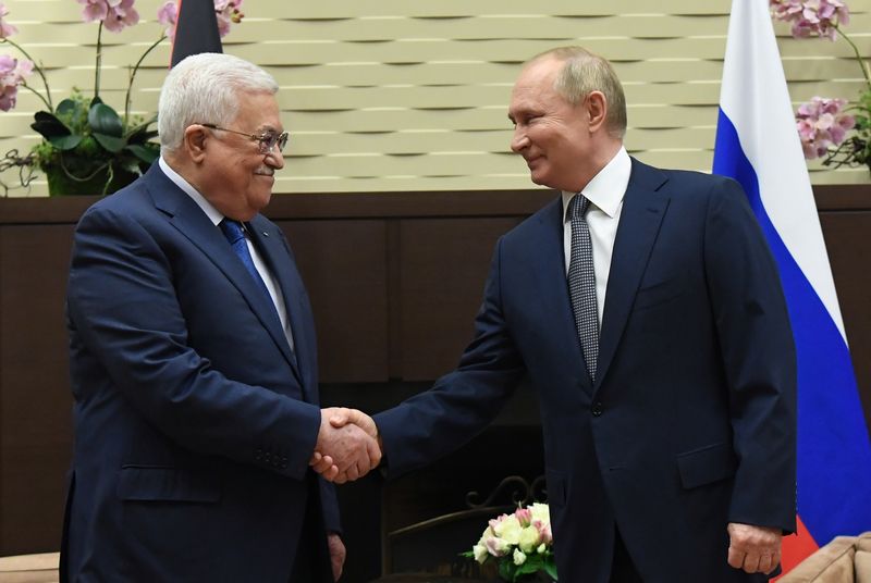 Russian President Vladimir Putin meets with Palestinian President Mahmoud Abbas