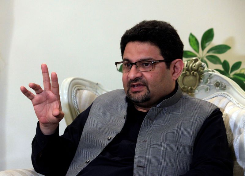 Pakistan’s new finance ministry chief Miftah Ismail speaks with a