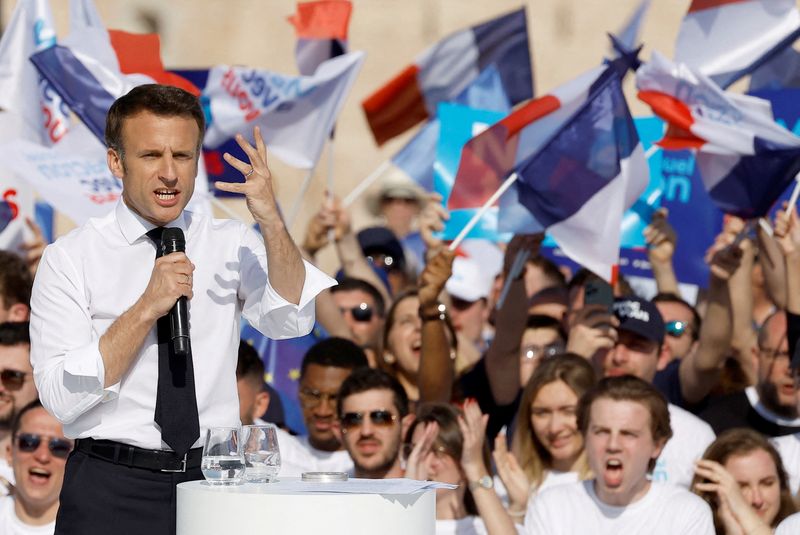 FILE PHOTO: French President Macron, candidate for the re-election, campaigns