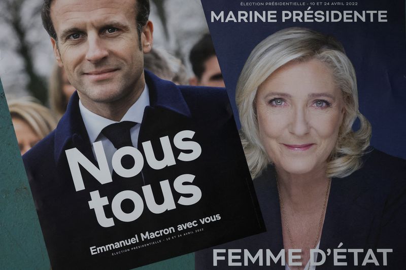 Official campaign posters of French presidential election candidates are displayed