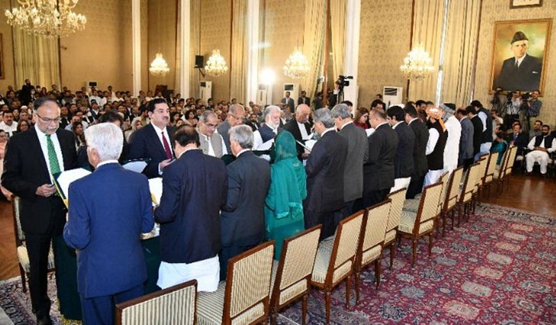Members of Pakistan’s new cabinet take the oath in a