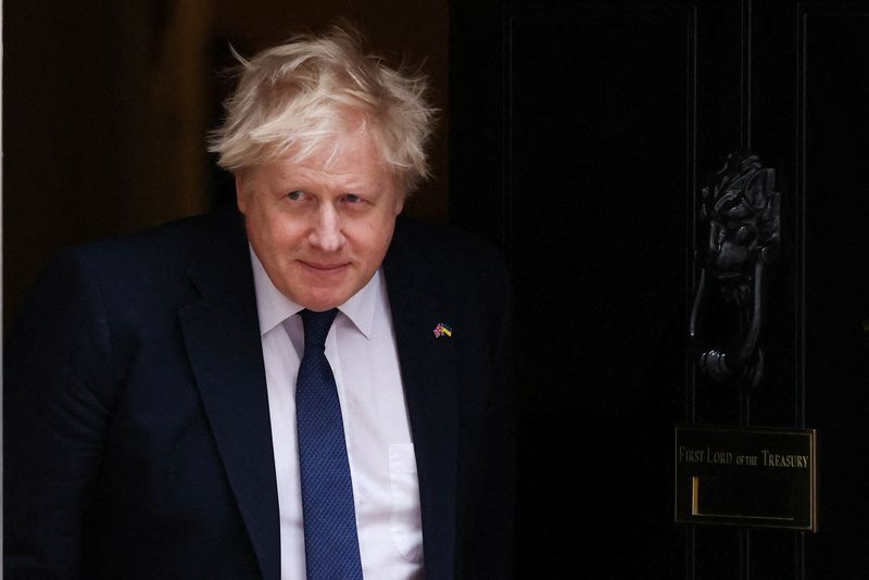 FILE PHOTO: British Prime Minister Boris Johnson walks in Downing