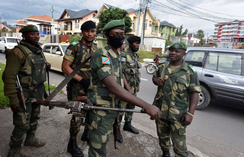 Congolese soldiers are seen outside the governor’s headquarters as the