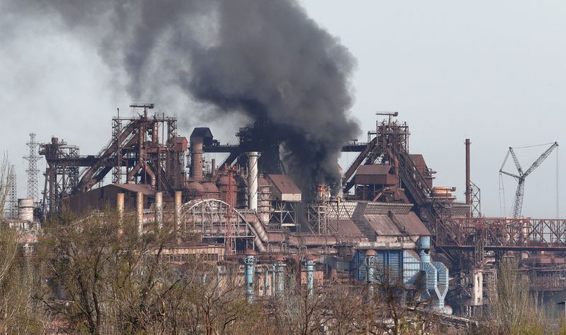 Smoke rises above a plant of Azovstal Iron and Steel