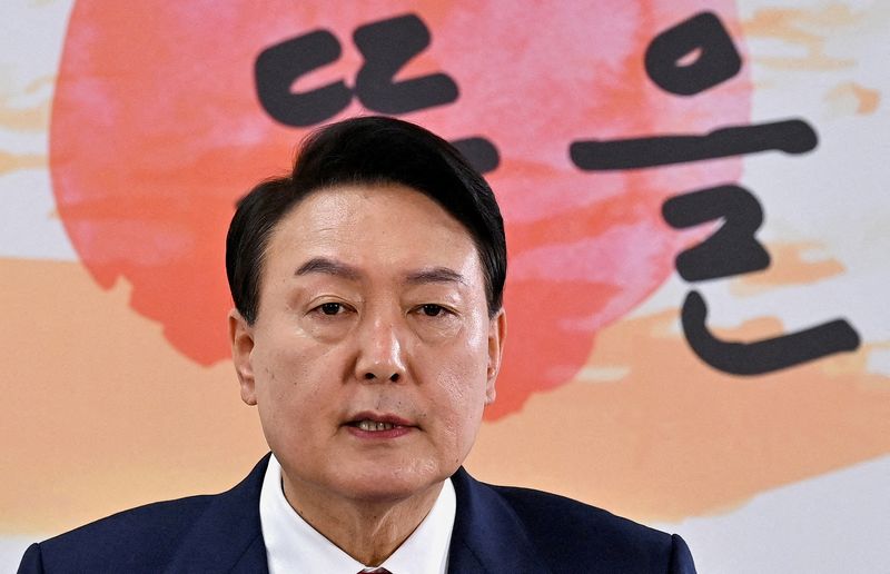 FILE PHOTO: South Korea’s president-elect Yoon Suk-yeol holds a news