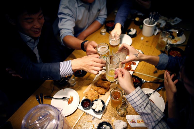 FILE PHOTO: People make a toast at a pub in