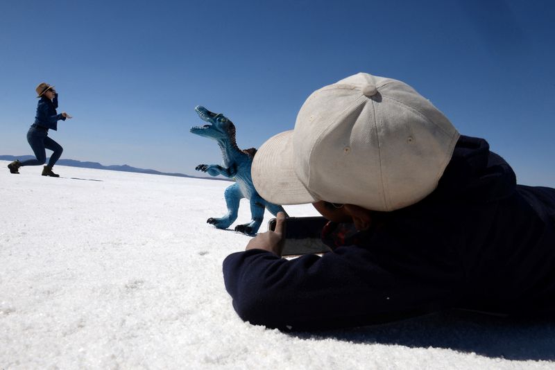 Uyuni Salt Flat attracts photo-seeking tourists, in Bolivia