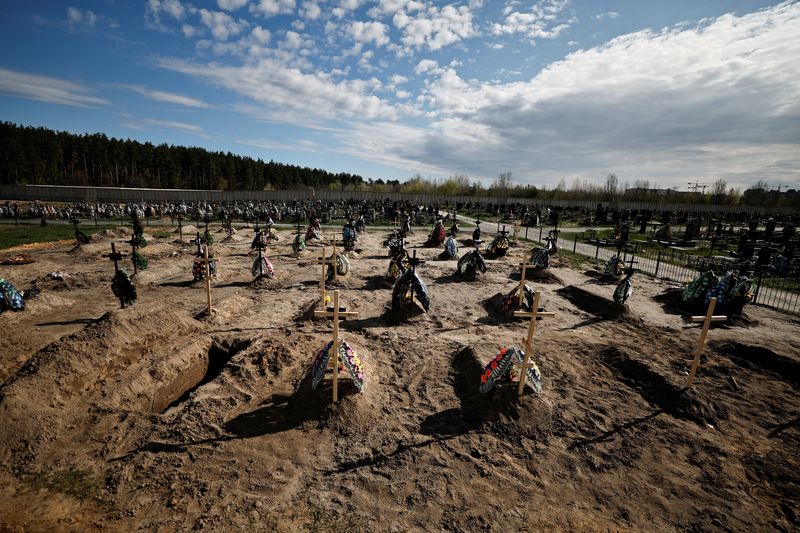 A view of new graves for people killed during Russia’s